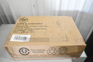 Box containing 3 new Wilton 2105-0454 bite-size brownie pans. Labeled as 12-compartment non-stick steel. Slight box damage.