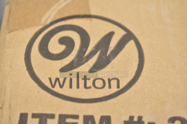 Box of 3 Wilton 12-compartment non-stick steel brownie pans, 2.5"x2.5"x1.5" cavities. New with scratch and dent packaging.