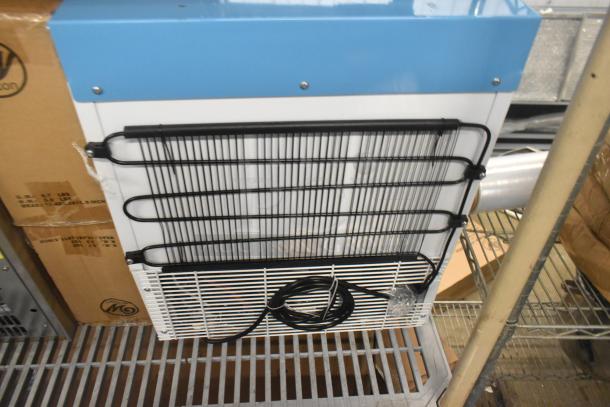 Brand new Summit ACR161W compact medical refrigerator, 1.58 cu. ft., white/blue, scratch and dent condition.