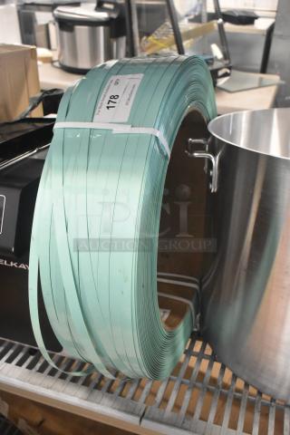 Coiled green banding with minor scratches, labeled "178 QTY." Brand new condition, visible in storage area.