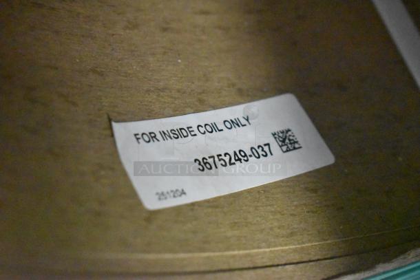 Brand new scratch and dent banding with label for inside coil only, code 3675249-037, slightly worn condition.
