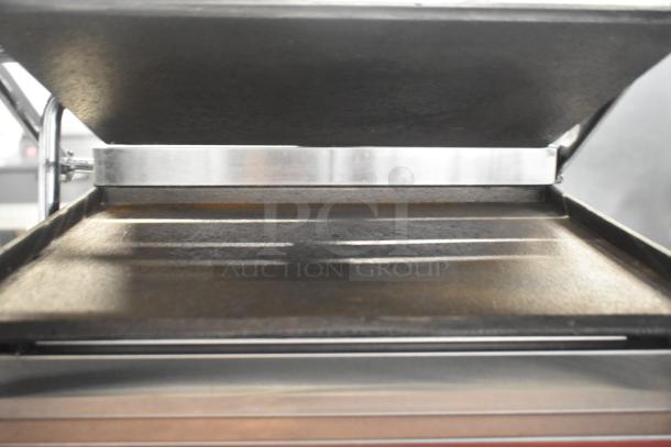 Brand new Avantco 177PG200S commercial panini grill with smooth plates, 13 3/8" x 8 3/4" surface, 120V, slight scratches.