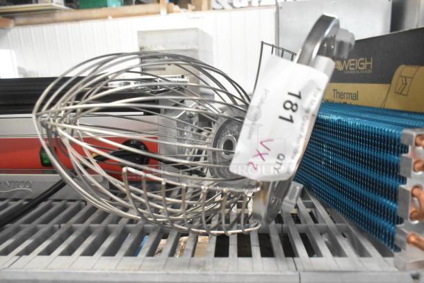 Metal whisk attachment with bowl guard, brand new scratch and dent, auction lot tag visible.