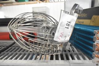 Metal whisk attachment with bowl guard, brand new scratch and dent, auction lot tag visible.