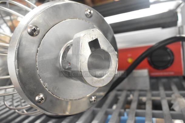 Stainless steel mixer attachment with whisk, bowl guard, new with minor scratches, includes power connector, auction item.