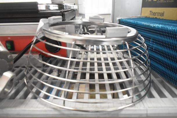 Stainless steel bowl guard with a whisk attachment, brand new with minor scratches, ideal for professional mixers.