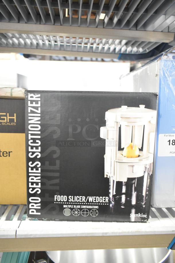 Sunkist B-202 Sectionizer Jr. with 6-Wedge Attachment, brand new with minor scratches, original box visible.