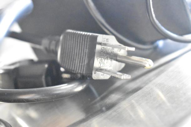 Power plug of AvaTek PCS40 40 lb. digital scale, showing slight scratches. Legal for trade, model 334PCS40.