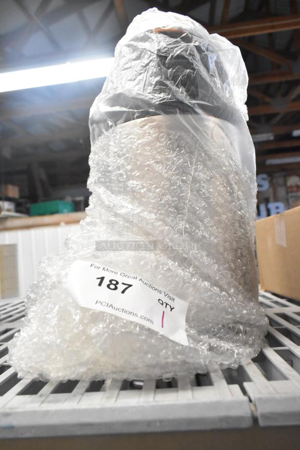Brand new Acopa Air Pot wrapped in bubble wrap. Label reads "187 QTY" with auction website URL.