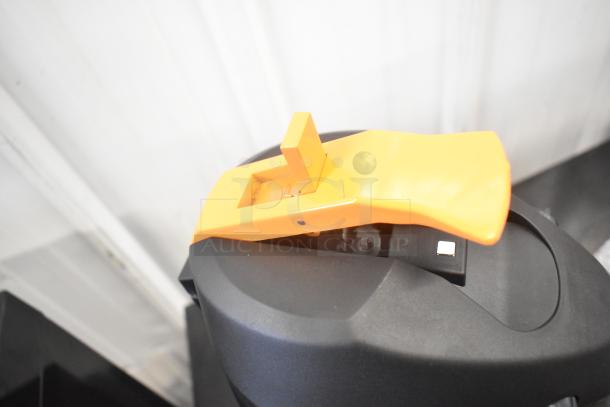 BRAND NEW Acopa Air Pot, scratch and dent, black with orange lever, top view.