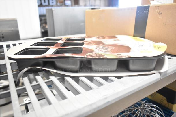 BRAND NEW Wilton 191002412 12-compartment non-stick steel brownie pan, 2.5"x2.5"x1.5" cavities, slight packaging dent.