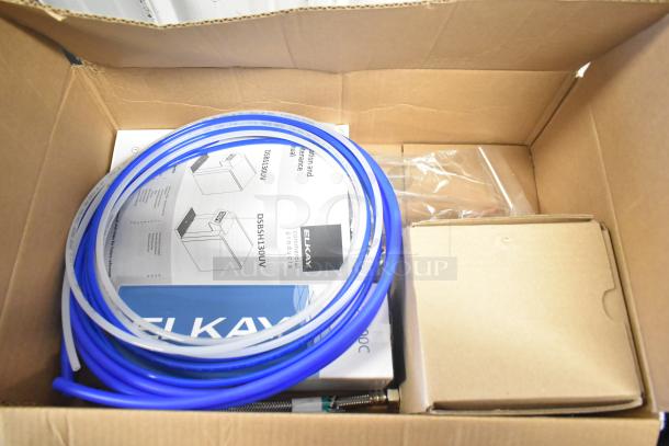Brand new 2024 Elkay DSBSH130UVPC stainless steel water dispenser in box, includes manual and fittings.