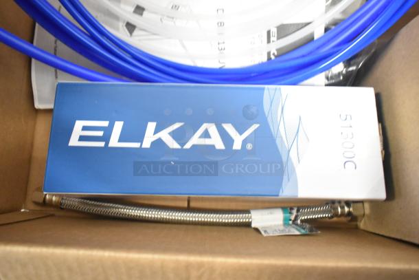 Brand new 2024 Elkay DSBSH130UVPC stainless steel countertop water dispenser in packaging; includes hoses and manual.
