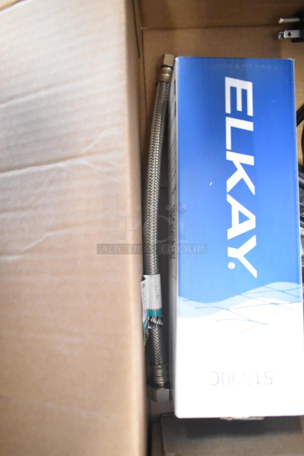 BRAND NEW 2024 Elkay DSBSH130UVPC stainless steel countertop water dispenser, boxed, 1.5 GPH, offers hot, chilled, and sparkling options.