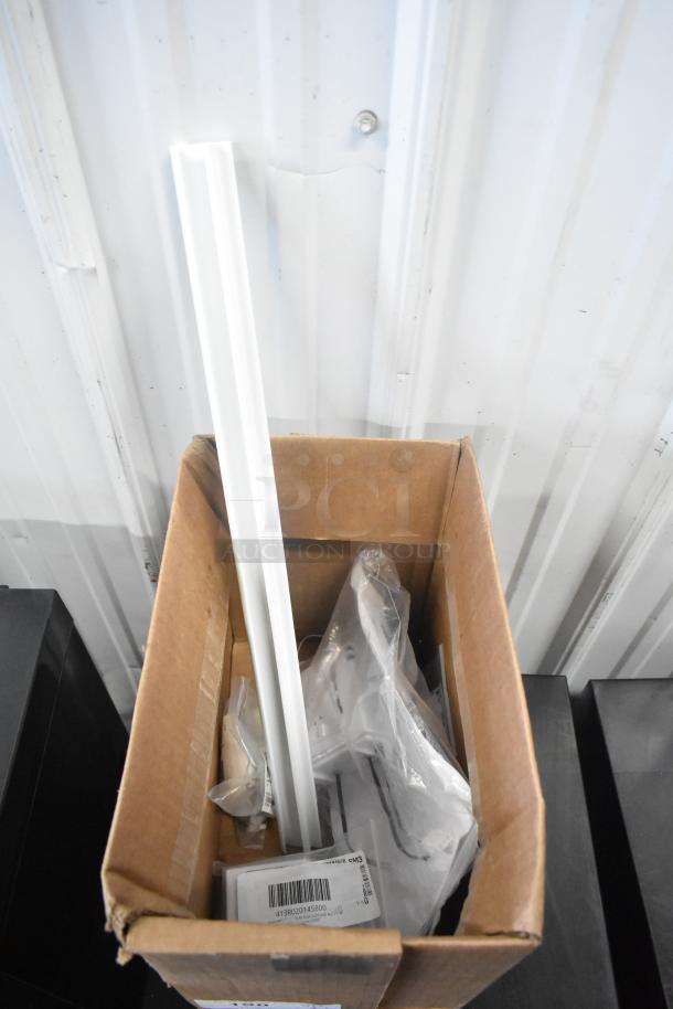 Box of 5 new items including MainStreet Equipment tag holder, Ice-O-Matic float switch, Hatco controls, Hobart conveyor kit, Hatco relay kit, visible labels.