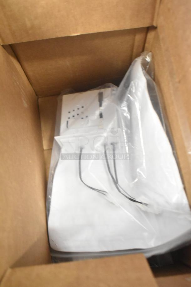 Box containing a new equipment part, sealed in plastic. Brand and model details not visible in the image.