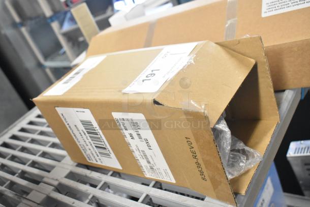 Cardboard box containing Zhongshan Broad 51078 Motor, 208/230V, 1 Phase. Box has shipping labels and minor dents.