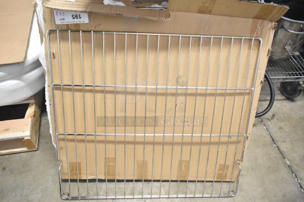 Brand new scratch and dent metal racks, still in original packaging with visible box wear. Item labeled as 195, Qty 1.