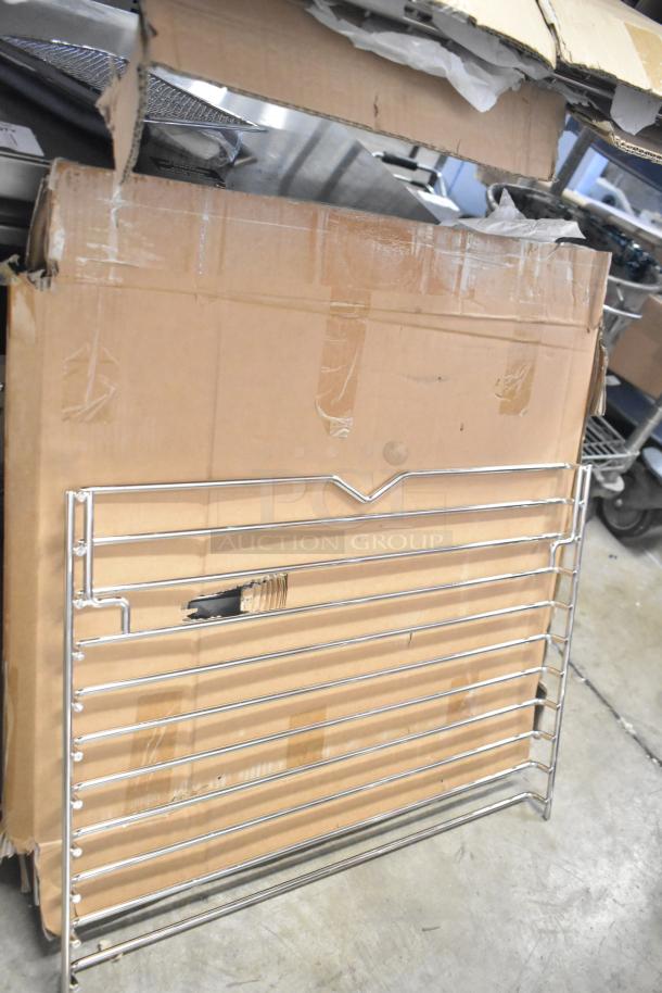 Brand new scratch and dent metal rack in packaging. Slight box wear. Auction includes three items.