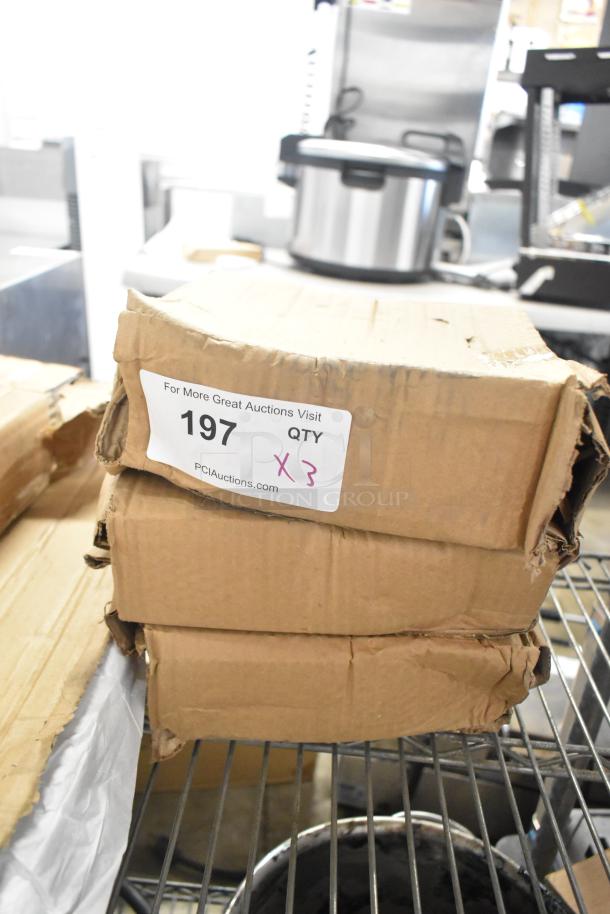 Box of 6 white ceramic plates, brand new with scratch and dent condition. Visible label: "197 QTY X3" from PCI Auctions.