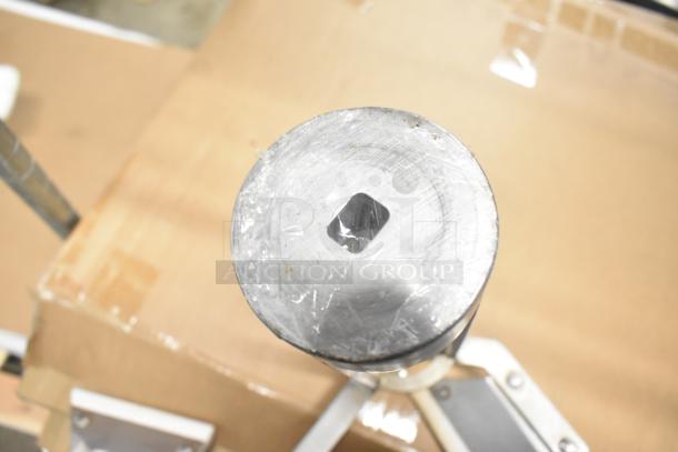 Mixing auger top view, metal with square cutout, part of a lot including pelican head front piece.