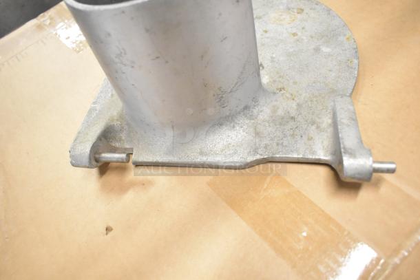 Metal component with cylindrical structure, moderate wear, part of a 3-item auction including a mixing auger and Pelican head front piece.