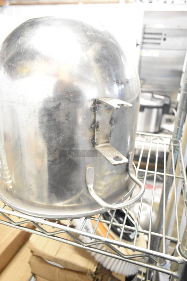 Five kitchen items including a large stainless steel mixing bowl and paddle attachment, visible wear, auctioned as lot.