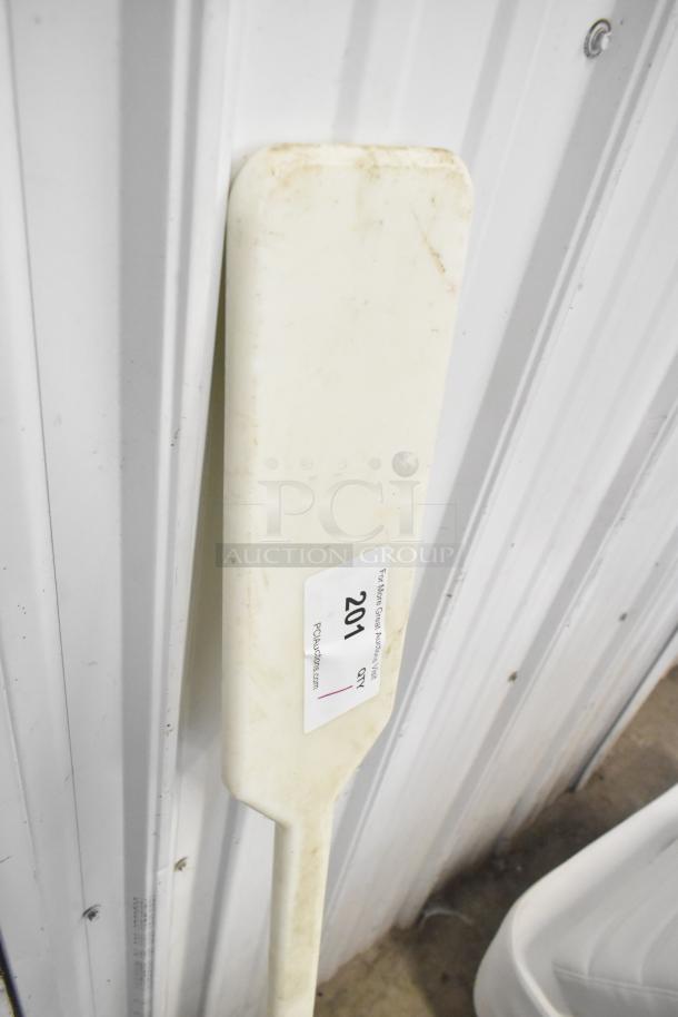White mixing paddle, rectangular shape, with small label reading "201". Used condition with slight discoloration.