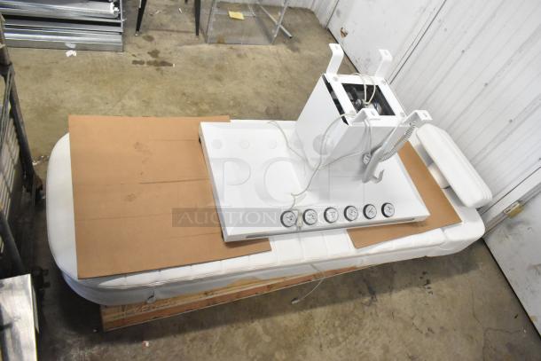 Electronic bed with seat positioning remote; features include heat option and multiple control buttons. ตัว product ในการใช้งานใหม่.