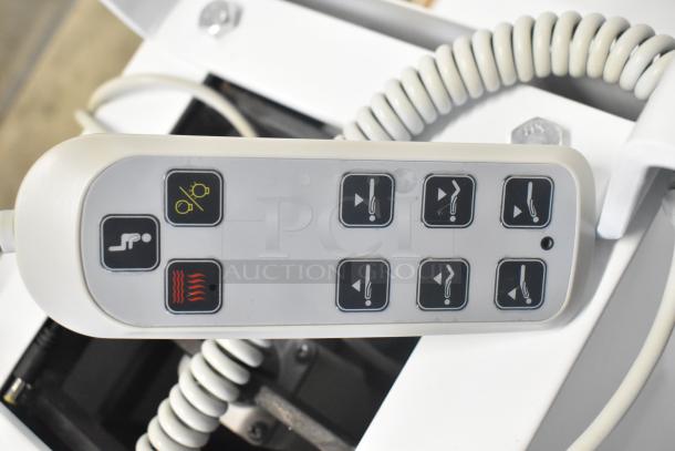 Remote control for electronic bed with seat positioning and heat option, showing various adjustment buttons.