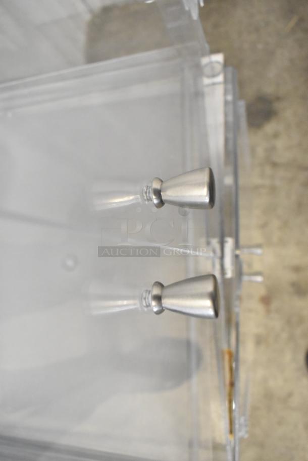 Two clear poly countertop cabinets with sleek metallic handles, ideal for display, in excellent condition.