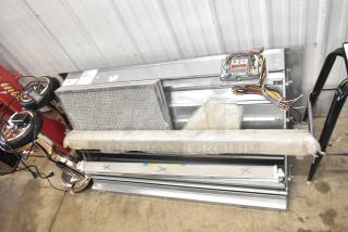 Brand new Daikin hood with McDaniels Metal 122-DK-090 economizer, vertical/downflow, low leak, slight scratches, wrapped in protective bubble wrap.