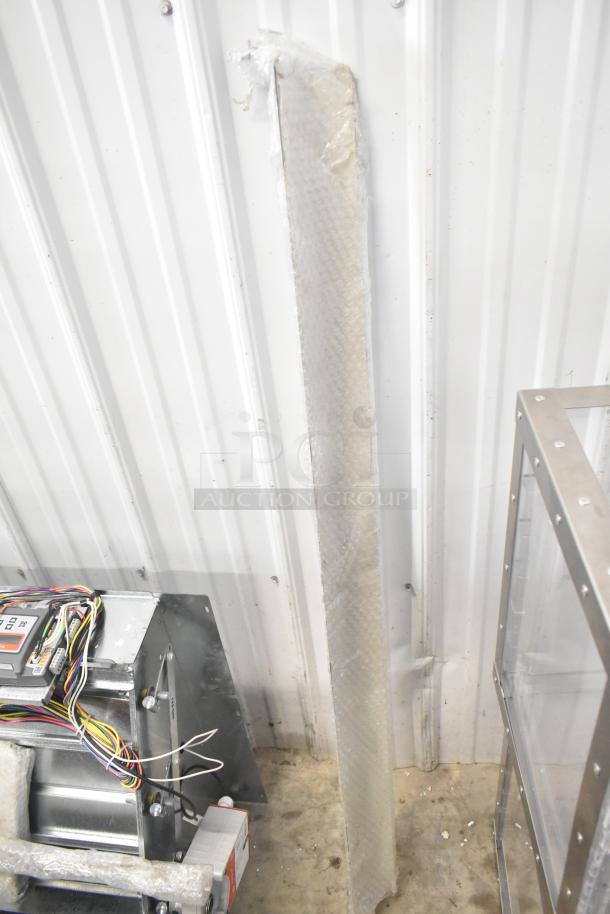 Brand new Daikin hood with McDaniels Metal 122-DK-090 economizer, vertical/downflow, low leak, minor scratches visible.