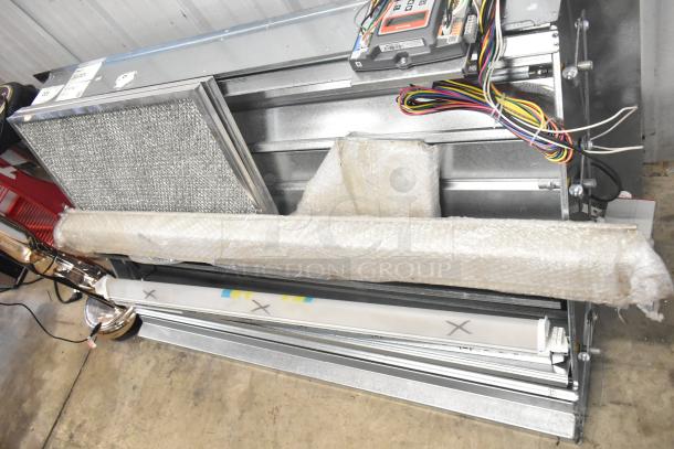 BRAND NEW Daikin Hood w/ McDaniels Metal 122-DK-090, vertical/downflow low leak Jade Economizer, minor scratches visible.