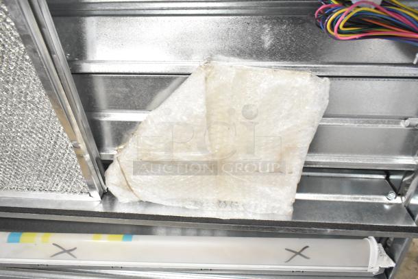 BRAND NEW Daikin Hood with McDaniels Metal 122-DK-090 Economizer, scratch and dent, features color-coded wires and bubble wrap.