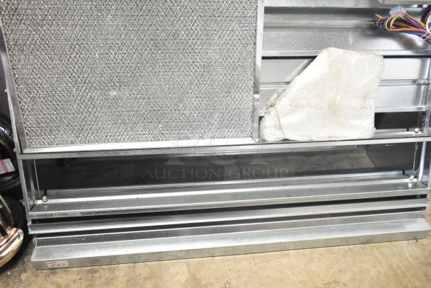 Brand new Daikin hood with McDaniels Metal 122-DK-090, vertical/downflow, low leak Jade economizer, minor scratches.