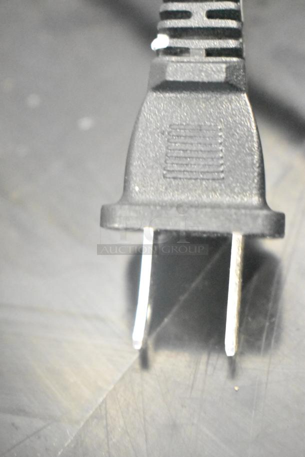 Close-up image of a power plug, possibly associated with the Hover-1 Titan HY-TTN hoverboard.