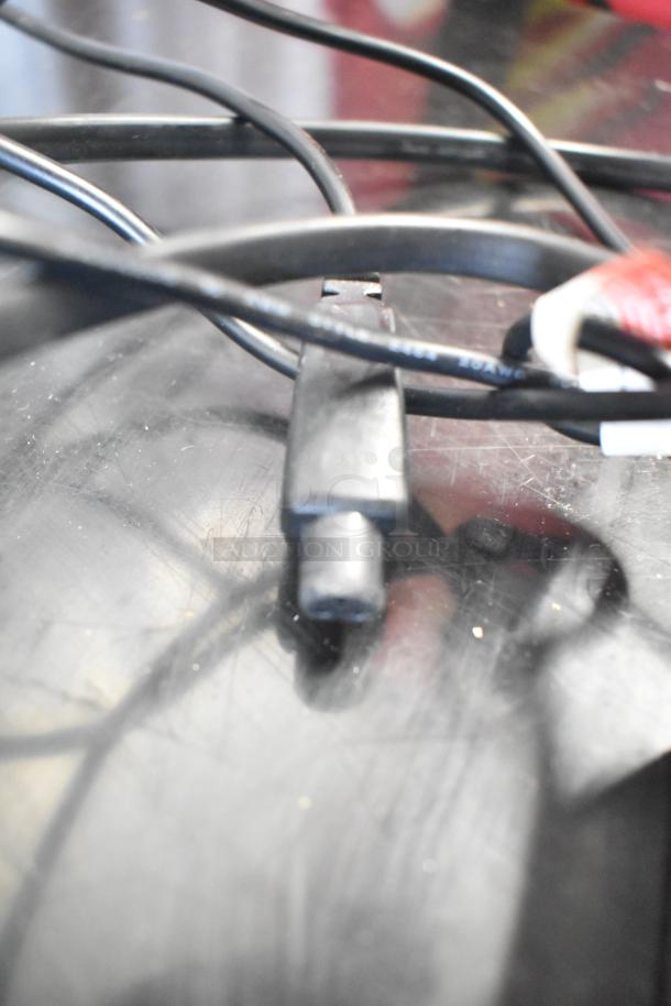 Alt text: Close-up of black cables and connectors, possibly related to a Hover-1 Titan hoverboard setup.