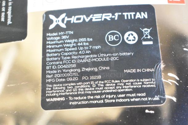 Label of Hover-1 Titan HY-TTN hoverboard, 36V, 265lbs max weight, 7 mph max speed, lithium-ion battery. Made in China.