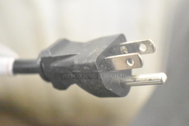 Close-up of a power plug for the Avalon A23 water dispenser, showing three prongs; part of a 115-volt, 1-phase unit.