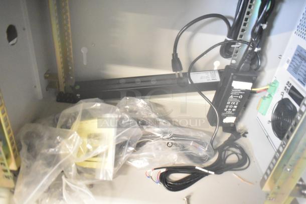 2 BlackShields DC0300 white metal air-conditioned cabinets with cables and components in new condition.