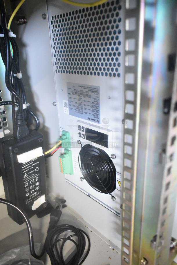 2 BlackShields DC0300 white metal air-conditioned technology cabinets, interior view, wiring, and power supply.