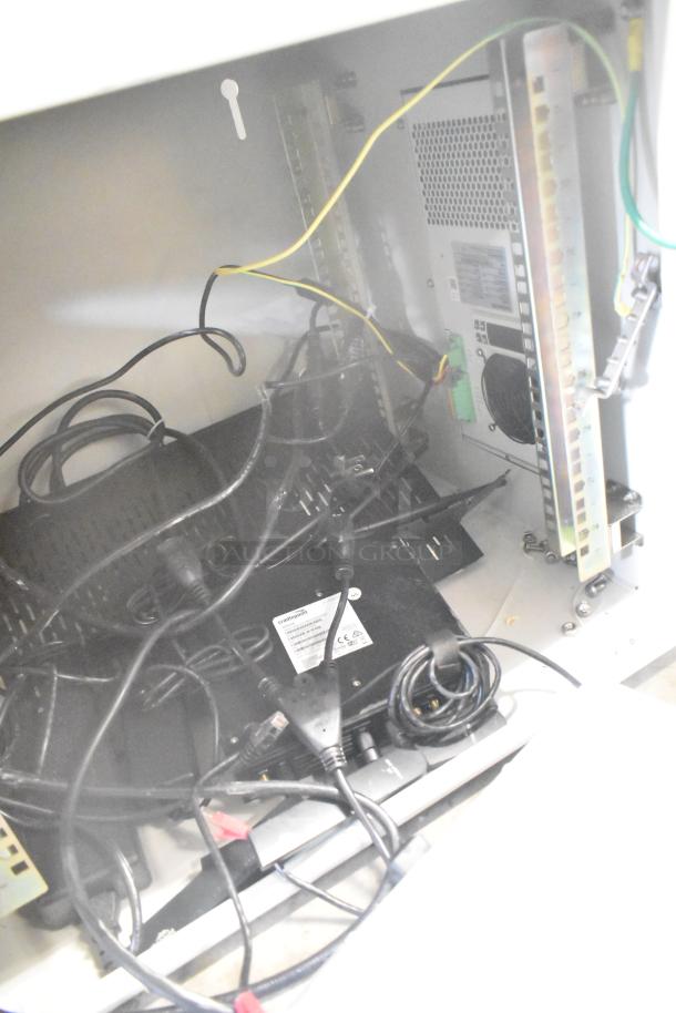 2 BlackShields DC0300 white metal air-conditioned technology cabinets with visible cables and power units.