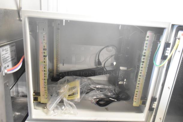 Two BlackShields DC0300 white metal cabinets with air conditioning. Open front shows internal components and wiring.