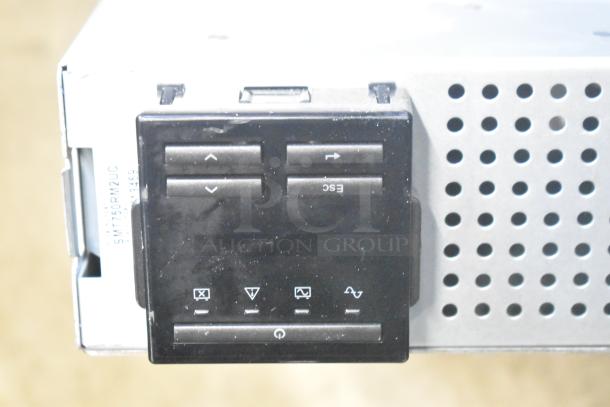 BlackShields DC0300 white metal air-conditioned cabinet, showing control panel with buttons, and model tag SMT750RM2UC.