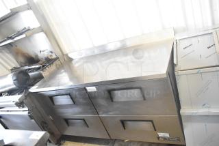 True TWT-60D-4 commercial cooler, stainless steel, 4 drawers, 115 volts, 1 phase, excellent condition, visible True logo.