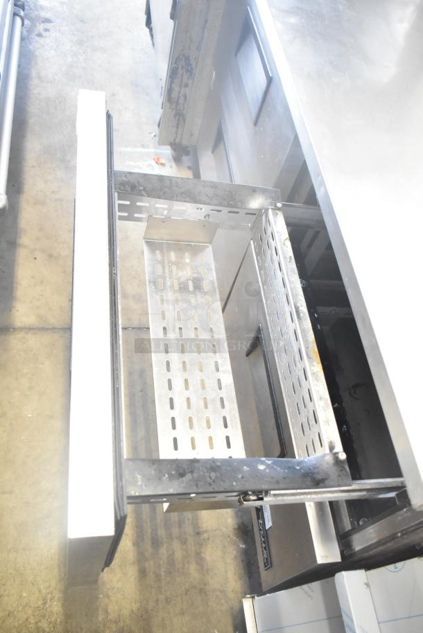 True TWT-60D-4 commercial 4-drawer work top cooler; 115V, 1 phase, stainless steel, open drawer view, good condition.