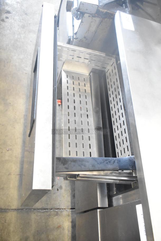 True TWT-60D-4 commercial work top cooler with 4 drawers, stainless steel, 115V, 1 phase. Interior view shown.