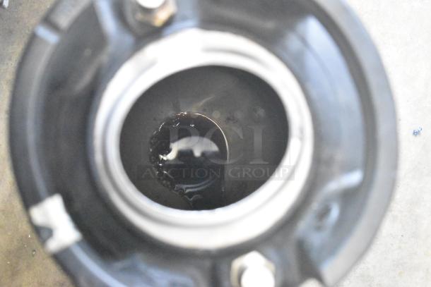 Top view of a 5-gallon keg, showing the interior with liquid inside. The keg appears to be in used condition.