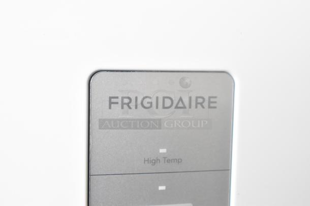 Frigidaire FRAE2024AWB Reach-In Cooler, brand new with minor scratches. Logo detail shown. 115V, 1 Phase.